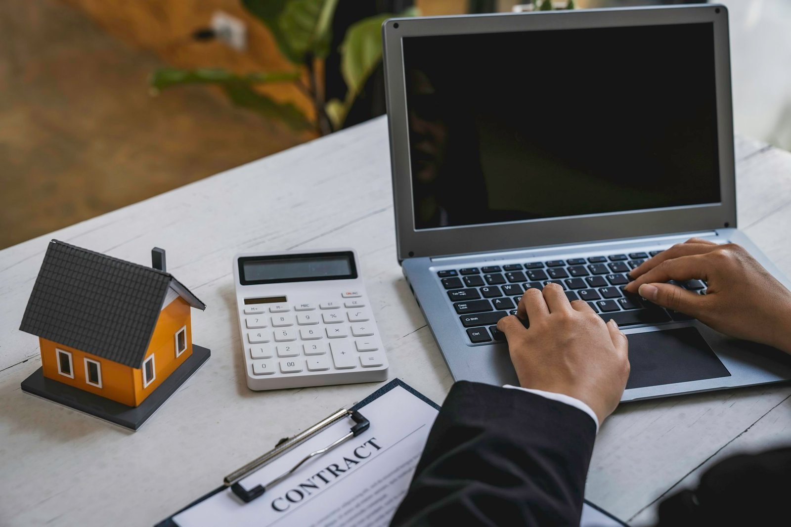 Business Signing and analyzing a contract buy - sell house, insurance agent analyzing cost about hom
