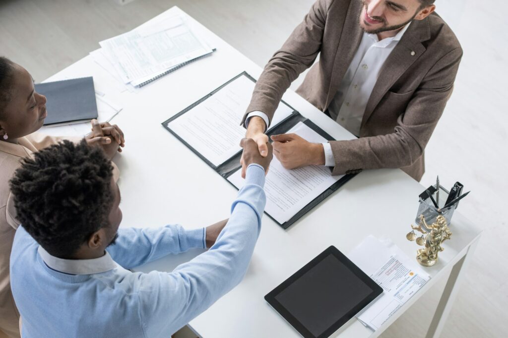 Couple Signing Mortgage Document